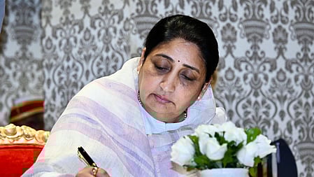 Mumbai: Sunetra Pawar, leader of the NCP legislative party and wife of former Deputy Chief Minister Ajit Pawar, signs an official document after taking oath as the Deputy Chief Minister of Maharashtra at the Lok Bhavan in Mumbai on Saturday, January 31, 2026.