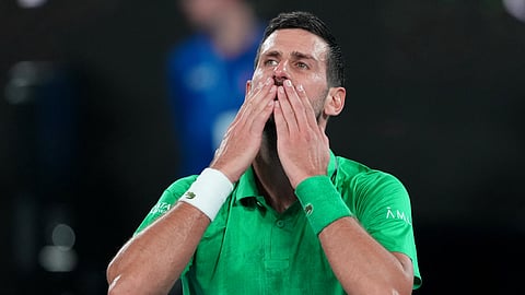 Novak Djokovic of Serbia celebrates after defeating Jannik Sinner of Italy in their semifinal match at the Australian Open tennis championship in Melbourne, Australia, early Saturday, Jan. 31, 2026.