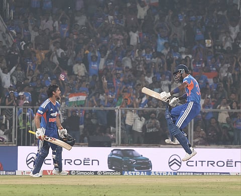 Ishan Kishak celebrates his hundred with Hardik Pandya against New Zealand on Saturday.