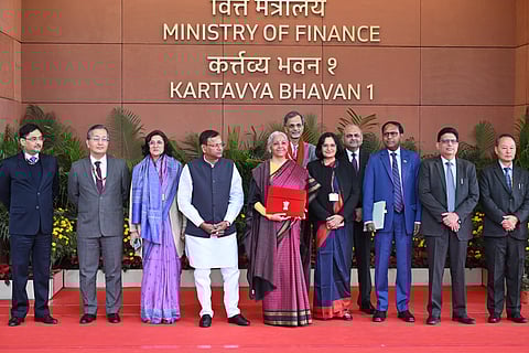 Union Finance Minister Nirmala Sitharaman with Union Minister of State for Finance Pankaj Chaudhary and other officials outside the Finance Ministry ahead of the presentation of the 'Union Budget 2026-27 at Ministry of Finance Kartavya Bhavan in New Delhi on Sunday.