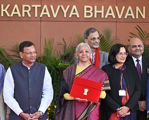 Union Finance Minister Nirmala Sitharaman with Union Minister of State for Finance Pankaj Chaudhary and other officials outside the Finance Ministry ahead of the presentation of the 'Union Budget 2026-27 at Ministry of Finance Kartavya Bhavan in New Delhi on Sunday. 