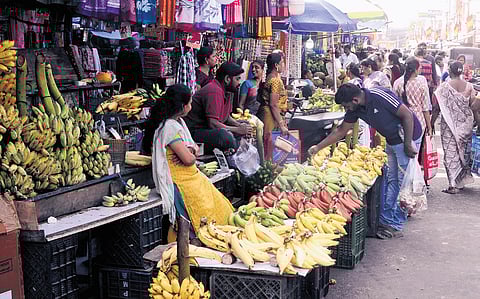 Street vendors selling fruits and other goods on Shanmugam Road in Tambaram 
