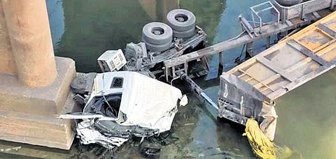 The mangled remains of the ill-fated truck in Sankha river. 