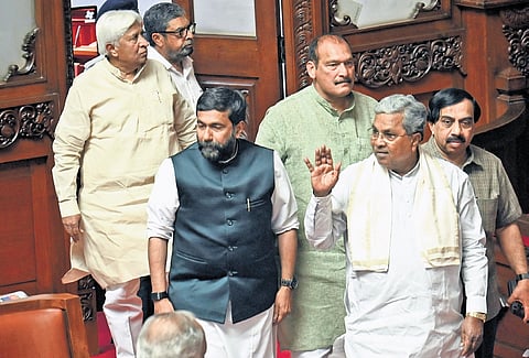 Chief Minister Siddaramaiah and other Congress leaders arrive at the Legislative Council in Vidhana Soudha in Bengaluru on Monday.