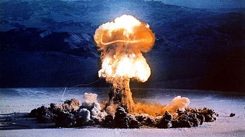 A mushroom cloud rises from a test blast at the Nevada Test Site on June 24, 1957.