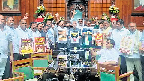 BJP-JDS MLAs launch an overnight dharna inside the Assembly in Vidhana Soudha on Tuesday, demanding the resignation of Excise Minister RB Timmapur in the alleged multi-crore scam, and urging a probe by a HC judge or CBI.  