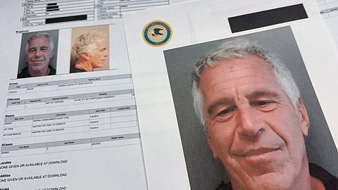 FILE - Documents that were included in the U.S. Department of Justice release of the Jeffrey Epstein files are photographed Friday, Jan. 2, 2026.