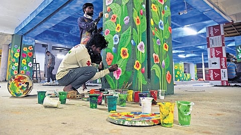 Workers deck up the basement parking at City Market complex on Wednesday ahead of its opening. The spruced up facility.