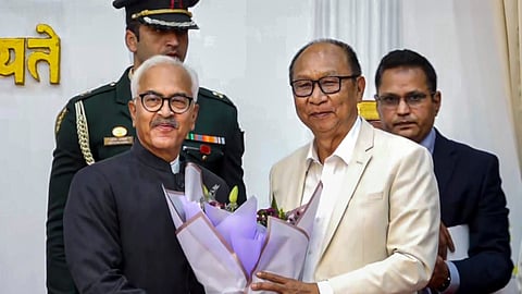 Manipur Governor Ajay Kumar Bhalla, left, felicitates BJP legislator Yumnam Khemchand Singh during the latter's swearing-in as the new state Chief Minister, in Imphal, Manipur, Wednesday, Feb. 4, 2026.