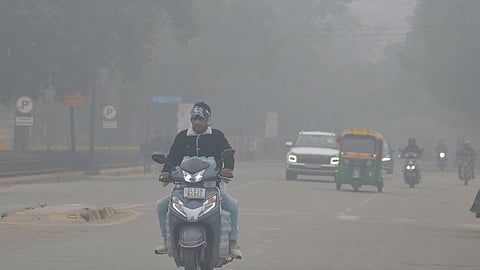 Vehicles seen amid smog on Tuesday morning near India Gate.