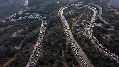 Vehicles stuck in a traffic jam on the Mumbai-Pune Expressway after a gas tanker overturned in the Khandala Ghat section, in Raigad district, Maharashtra, Wednesday, Feb. 4, 2026.