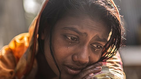 Meghna Rani, wife of Dipu Chandra Das, weeps inside her home in Tarakanda village, Mymensingh District, Bangladesh, Jan. 9, 2026.