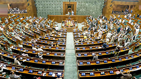 Opposition MPs protest in the Lok Sabha during the Budget session of Parliament, in New Delhi, Thursday, Feb. 5, 2026.