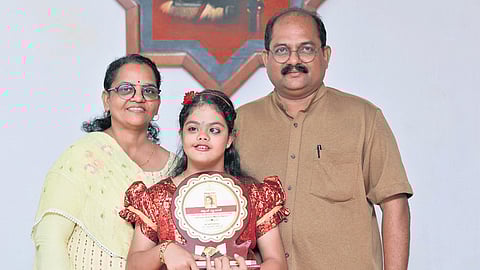 Ann Mookken with her parents