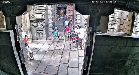 A screengrab from the CCTV footage released by the HR&CE department showing David Raja along with the four children at the Nellaiappar temple.