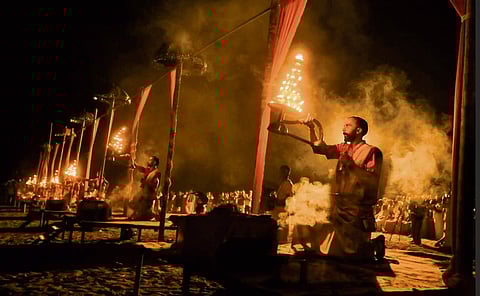 Priests performing Nila aarti on the banks of the Nila River during the Maamaankam festival