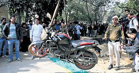 Kamal’s motorcyle being taken out of the pit with the help of a crane.