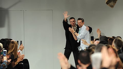 Raf Simons, left, chief creative officer, and Pieter Mulier, creative director, greet the audience after presenting their Calvin Klein runway show during Fashion Week.
