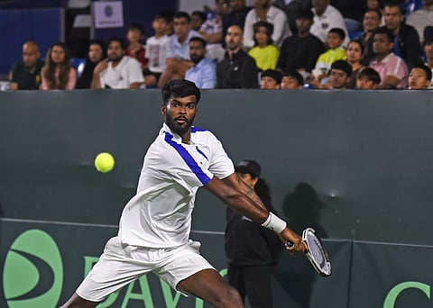 Dhakshineswar Suresh in action against Jesper De Jong in the Davis Cup qualifiers at the SM Krishna Stadium on Saturday
