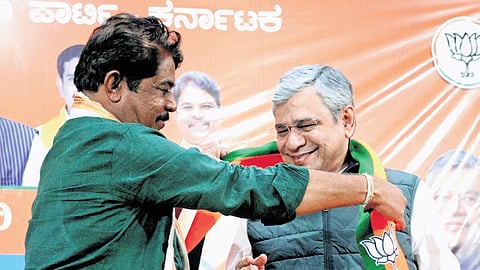 Leader of Opposition in Assembly R Ashoka greets Union Minister 
Ashwini Vaishnaw at BJP office in Bengaluru on Saturday.