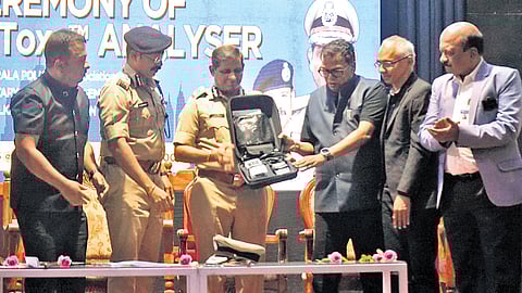 State Police Chief Ravada A Chandrasekhar receiving SoToxa analyser kits provided under the CSR initiative of the Walkaroo Foundation from foundation Chairman V Naushad at an event held at the Cusat auditorium on Saturday.