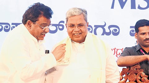 CM Siddaramaiah and Minister for Large and Medium Industries MB Patil in conversation during the launch of the new MSIL chits software and mobile app.