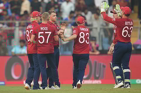 England's Sam Curran celebrates the wicket of Nepal's Dipendra Singh Airee with teammates during the T20 World Cup cricket match between England and Nepal in Mumbai, India, Sunday,Feb. 8, 2026.