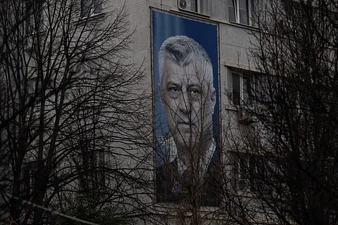 A giant banner depicting former Kosovo president Hashim Thaci is pictured in Pristina on February 6, 2026.