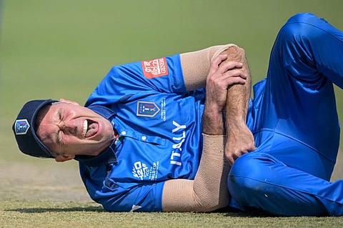 Italy captain Wayne Madsen hurts his hand during fielding on Monday