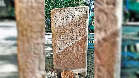 The stone slab with inscriptions.