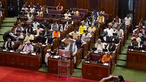 Uttar Pradesh Finance Minister Suresh Kumar Khanna presents the State Budget 2026-27 in the state Assembly, in Lucknow, Wednesday, Feb. 11, 2026. UP Chief Minister Yogi Adityanath is also seen.