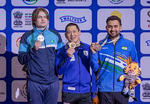 Anish Bhanwala (right) wins bronze on Wednesday