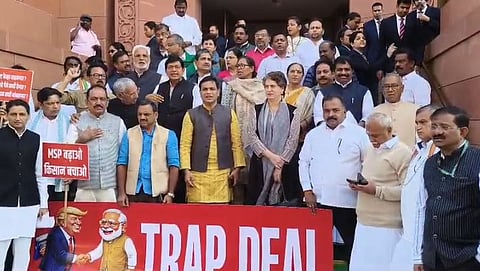 Opposition MPs protest in the Parliament premises against the India-US interim trade deal.