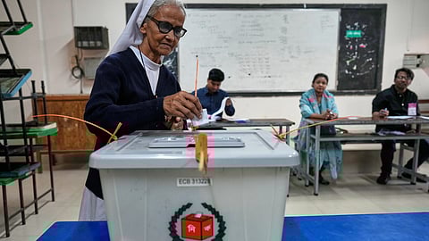 A Bangladeshi Christian nun casts her vote in a polling station during national parliamentary election in Dhaka, Bangladesh, Thursday, Feb. 12, 2026.