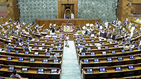 Oppostion MPs stage a protest in the Lok Sabha during the Budget session of Parliament, in New Delhi, Thursday, Feb. 12, 2026. 