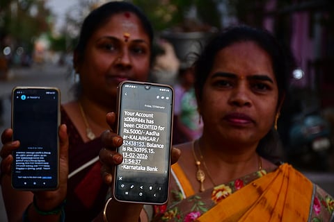 Women in Vellore show messages confirming the receipt of Rs 5,000 as the Magalir Urimai Thogai, as announced by Chief Minister M.K. Stalin on Friday