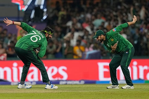 Pakistan's Usman Tariq, left, and Pakistan's captain Salman Agha celebrates the wicket of United States' Mohammad Mohsin during the T20 World Cup cricket.
