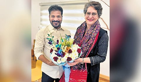 AICC general secretary Priyanka Gandhi and Chief Minister A Revanth Reddy beam at the Congress performance in the civic body polls, in New Delhi on Friday