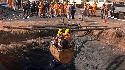 In this photo from Feb 7, 2026, NDRF officials carry rescue operations at an illegal rat-hole coal mine blast site to rescue the trapped mine workers, in East Jaintia Hills