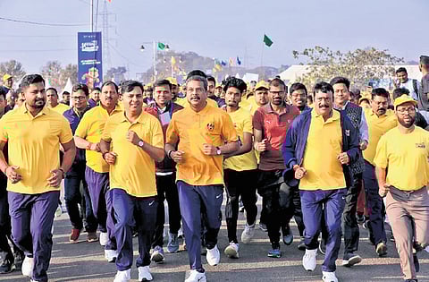 Union Minister Pradhan and others taking part in the half marathon on Sunday