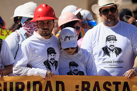 Relatives of Antonio Esparza, one of 10 mine workers abducted in neighboring Sinaloa state, during protest march in Hermosillo, Mexico, Saturday, Feb. 14, 2026
