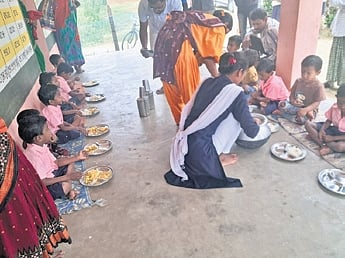 Sarmista Sethi serving food to kids at the anganwadi centre on Monday
