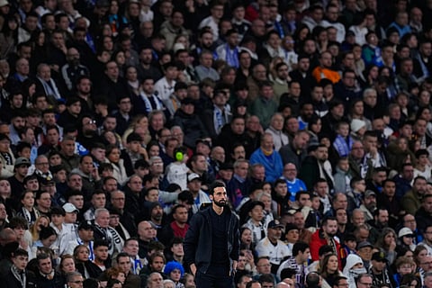 Benfica's head coach Jose Mourinho runs celebrating at the end of a Champions League opening phase soccer match between Benfica and Real Madrid.
