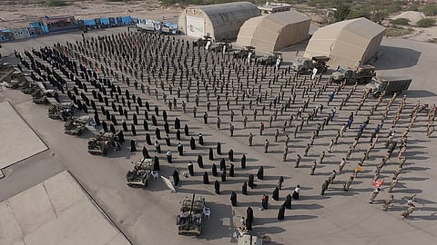 In this image provided by Sepahnews of the Iranian Revolutionary Guard on Feb. 16, 2026, shows troops standing at attention during the guard's drill in the Persian Gulf on Monday, Feb. 16, 2026.