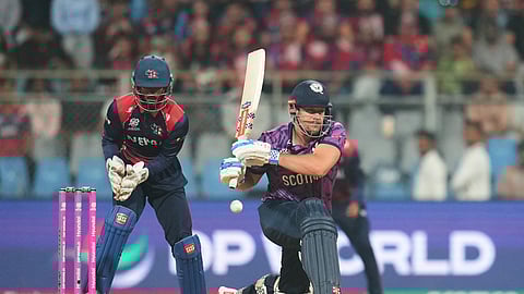 Scotland's George Munsey plays a shot during the T20 World Cup cricket match between Nepal and Scotland in Mumbai, India, Tuesday, Feb. 17, 2026.
