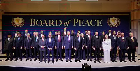 President Donald Trump stands with other World leaders before a Board of Peace meeting at the U.S. Institute of Peace, Thursday, Feb. 19, 2026, in Washington.