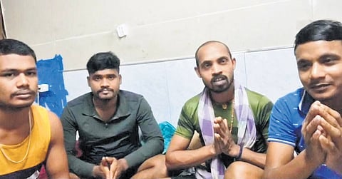 Video grab of four of the six workers seeking help from Odisha government