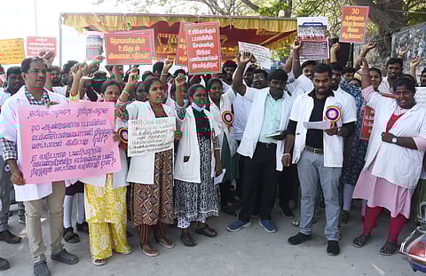Members of Dialysis Technicians Association stage a protest at Sivanandha Salai near Omandurar Multi Super Speciality  Hospital in Chennai on Wednesday.