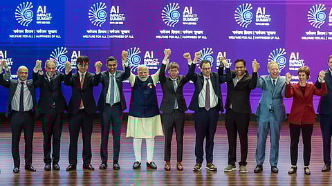 Narendra Modi with dignitaries at the AI Impact Summit 2026 at Bharat Mandapam on Thursday; Sam Altman of OpenAI stands to Modi’s right, alongside Dario Amodei of Anthropic.