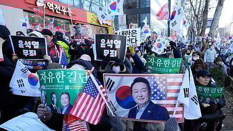 Supporters of former South Korean President Yoon Suk Yeol stage a rally outside of Seoul Central District Court in Seoul, South Korea, Thursday, Feb. 19, 2026.